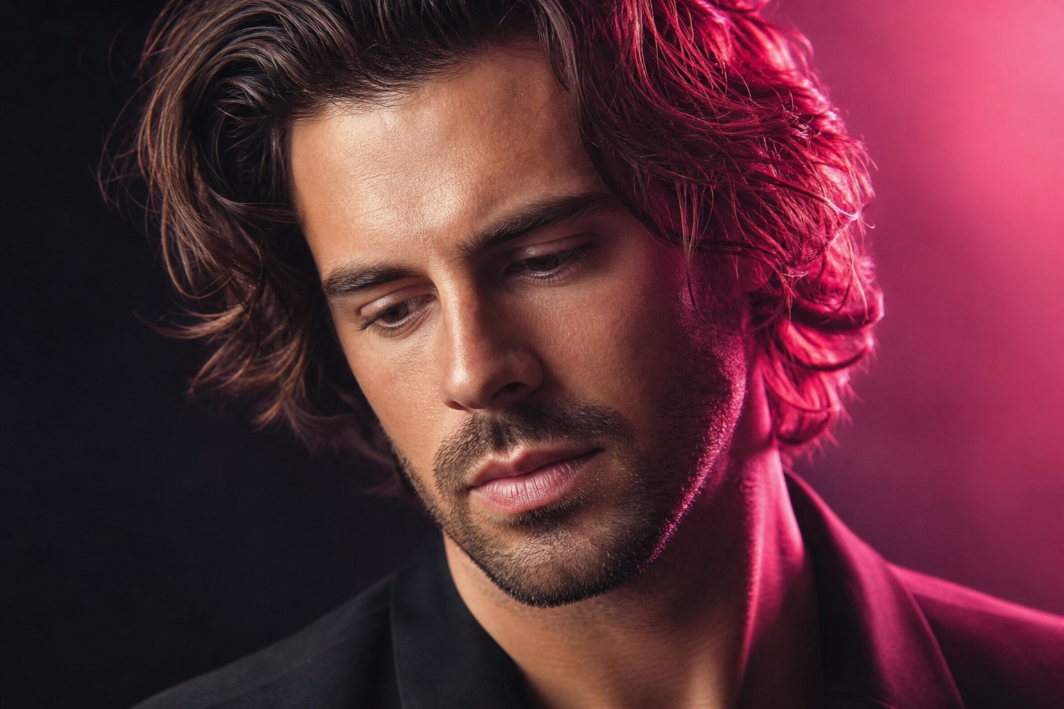 Close-up of a man with healthy hair under soft studio light